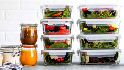 Glass meal prep containers stacked with detox body cleanse food.