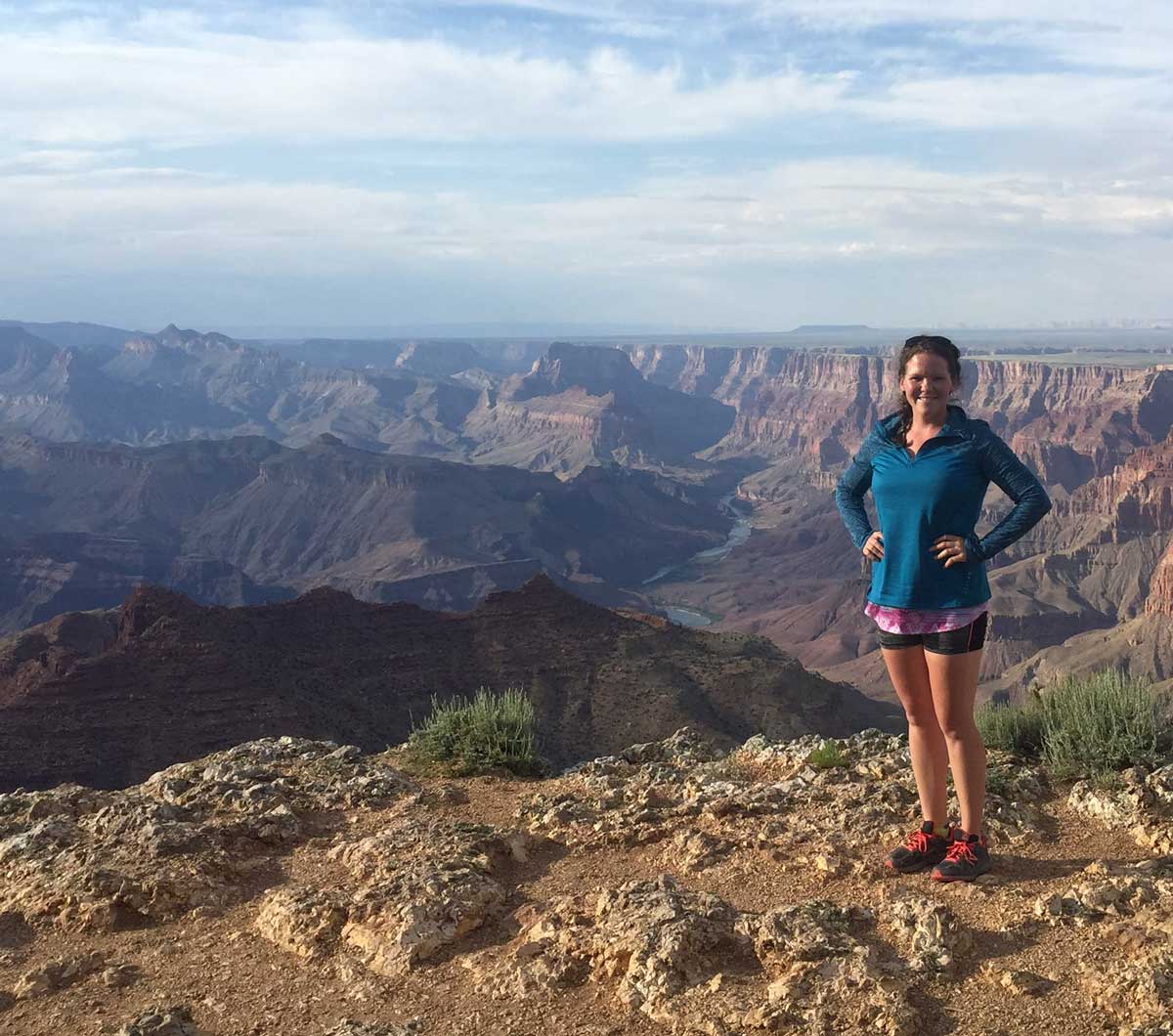 Fit woman standing in nature after doing 21-day cleanse detox.