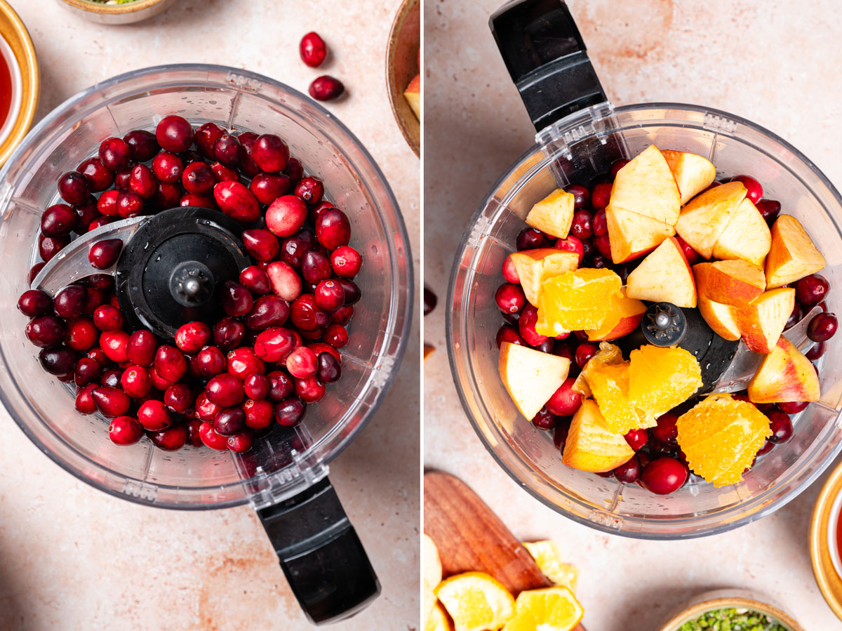 Food processor filled with cranberries and oranges.