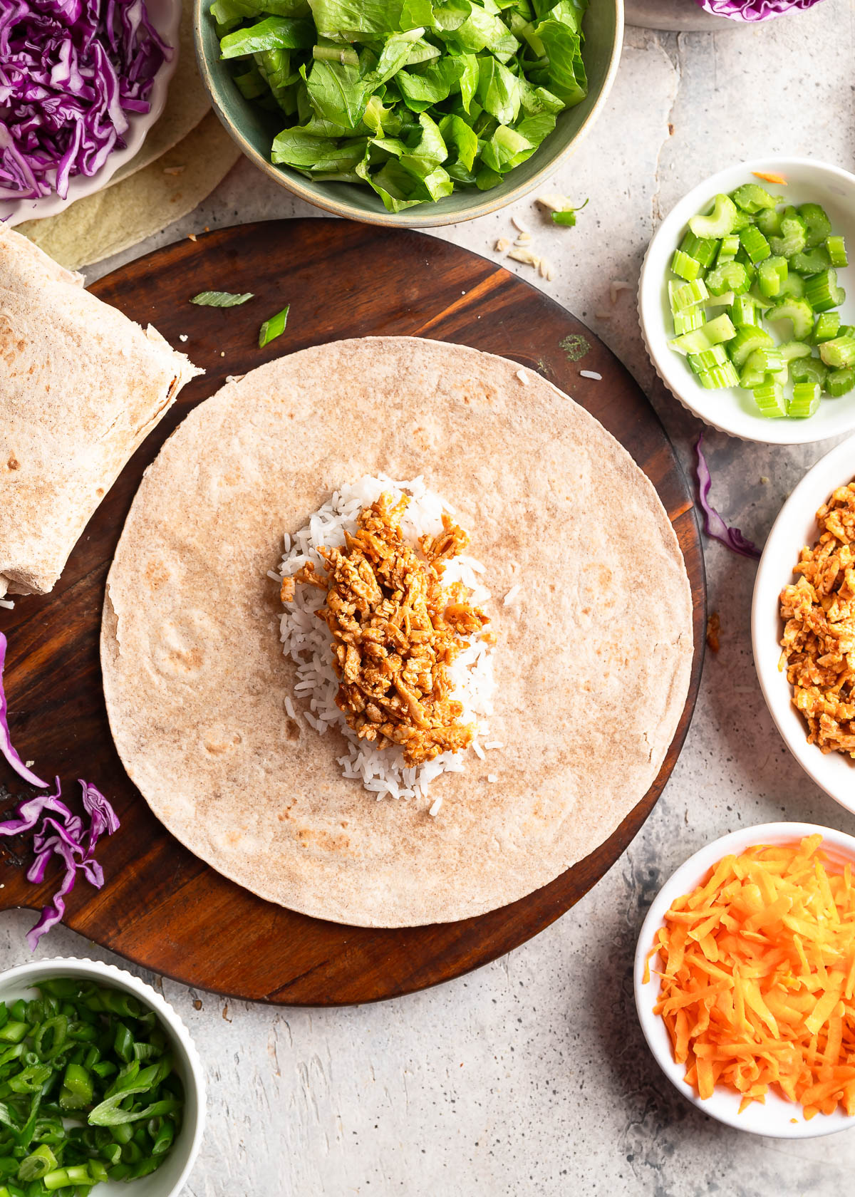 Tofu and other ingredients assembled on a tortilla.