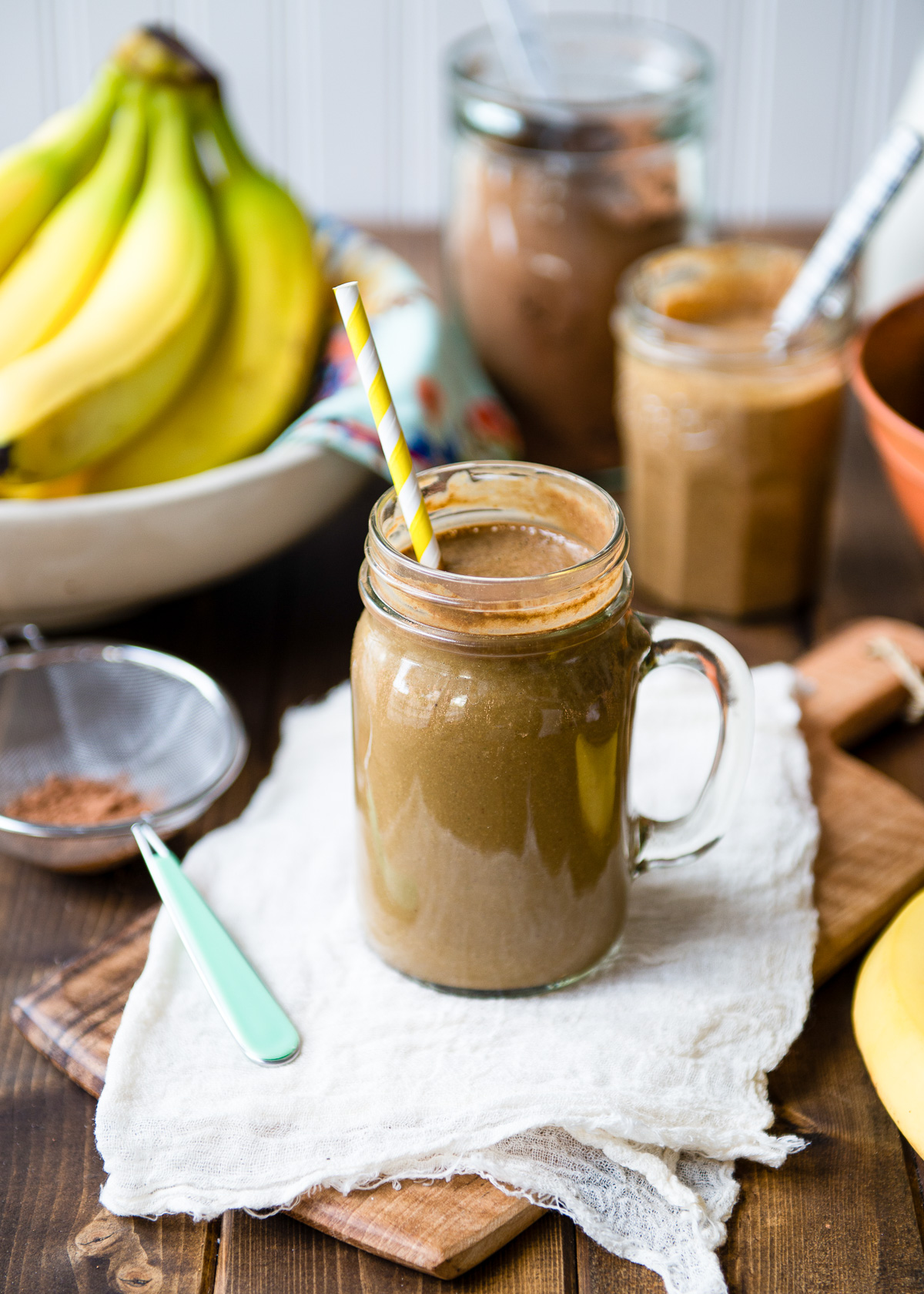 Chocolate banana smoothie glass placed on the countertop