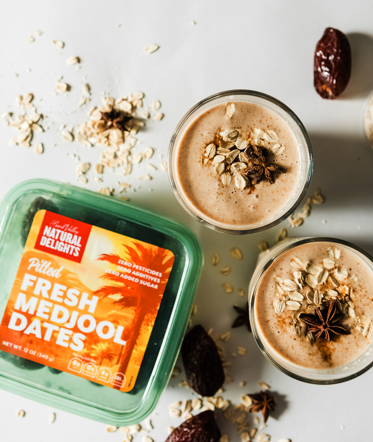 Serving a date smoothie with rolled oats sprinkled on top.