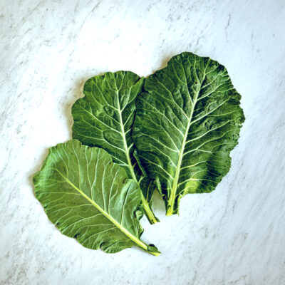 Collard greens on gray conter top.