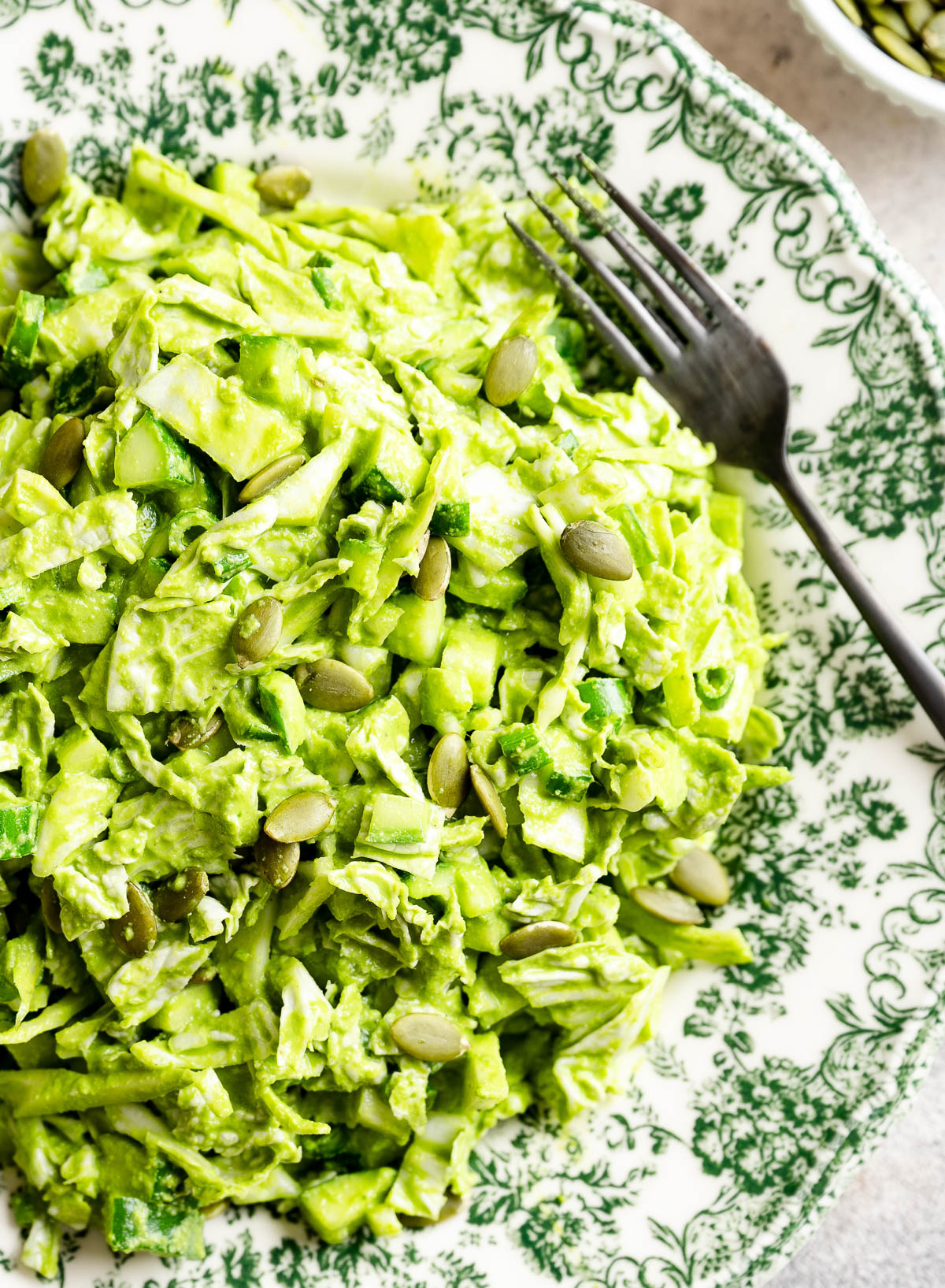 Green goddess salad served on a decorative plate, ready to enjoy.