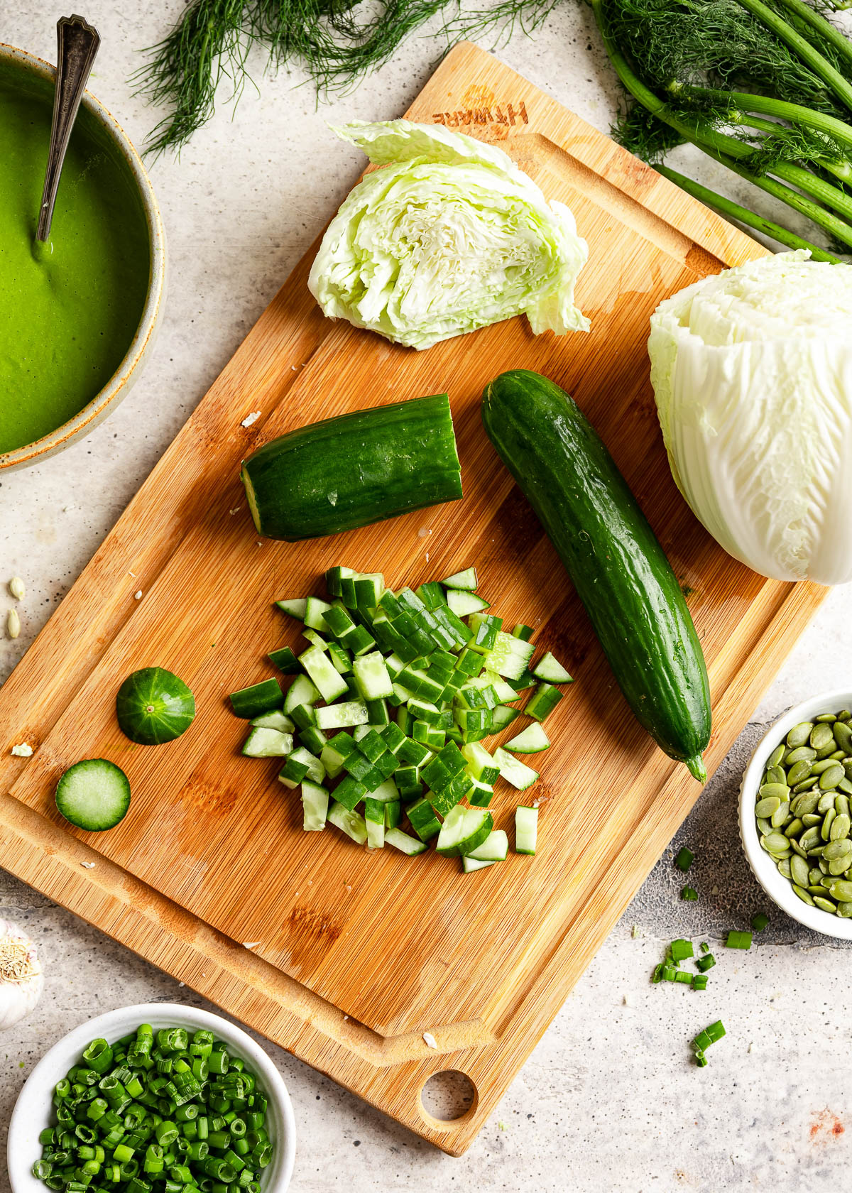 Diced cucumbers on a cutting board.