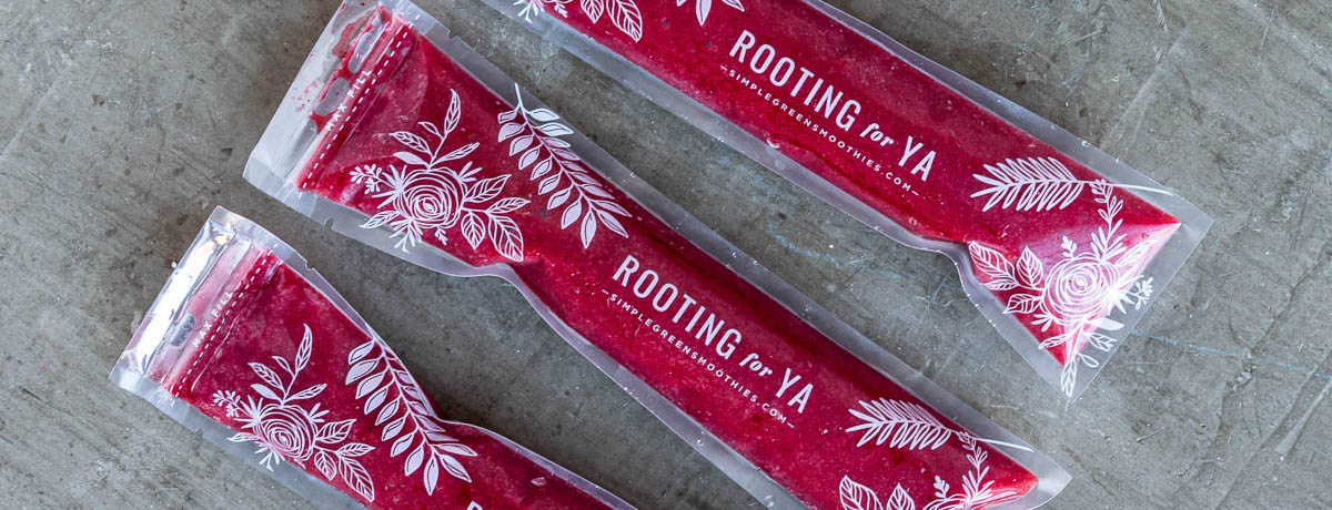 3 red pops in plastic sleeves that say rooting for ya.