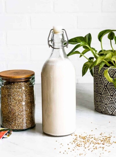 Creamy homemade oat milk recipe in a glass jar.