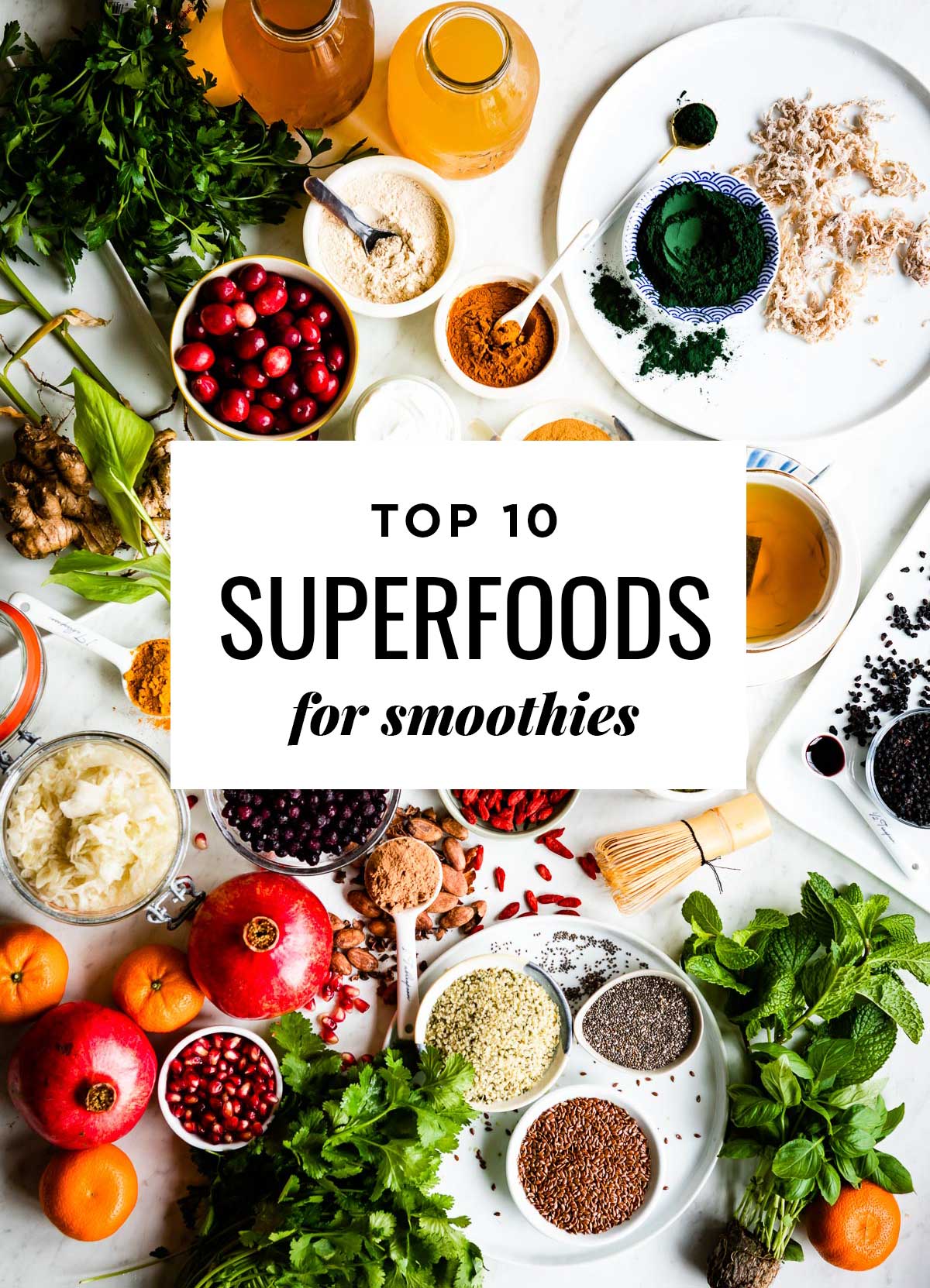 Top 10 Superfoods For Smoothies overtop a counter full of various superfoods.