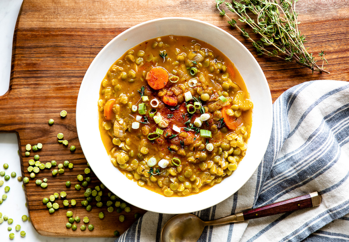 Vegetarian split pea soup in a white bowl ready to eat. 