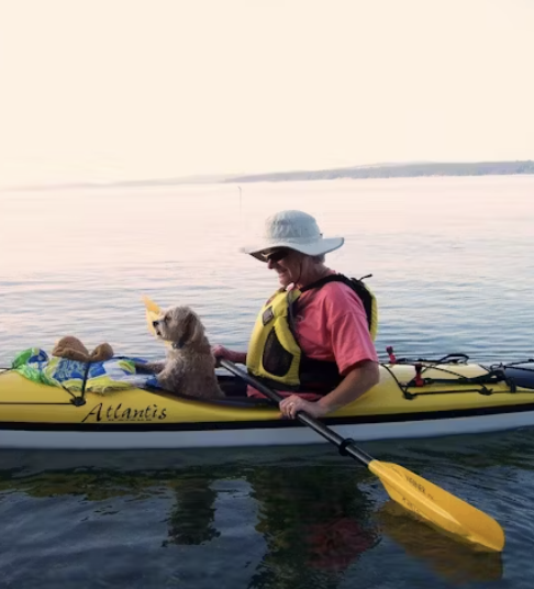 Glenda kayaking with her dog after her 21-day cleanse.